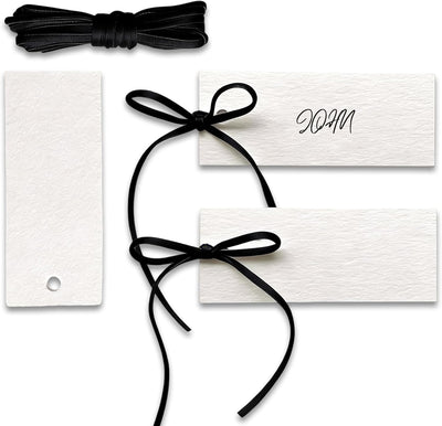 Tarjetas de lugar con cinta de terciopelo negro para bodas y eventos