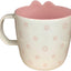 Taza de café con cara de Miffy blanca y rosa y garabatos de flores