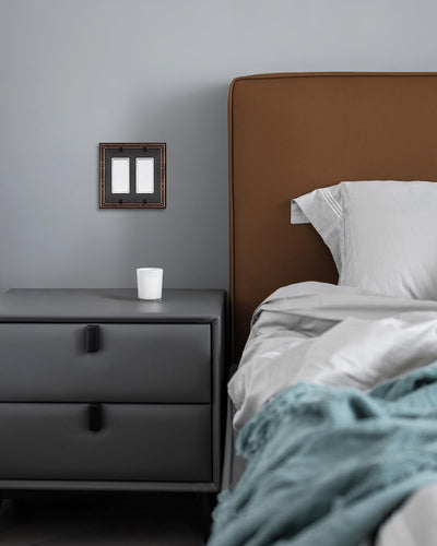 Placa pared doble bronce perlas enchufes GFCI