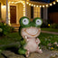 Estatua rana jardín solar con ojos LED giratorios