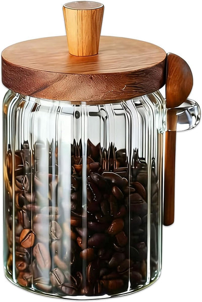 Tarro de vidrio con tapa y cuchara de madera para almacenar granos de café, posos, sal o té