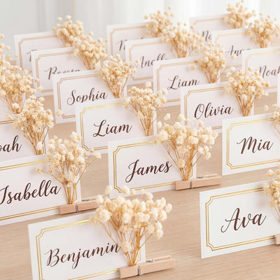 Paquete de 50 tarjetas de lugar de boda con clip de madera y aliento de bebé dorado