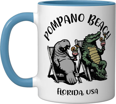Taza cerámica Pompano Beach con diseño manatí y cocodrilo azul/blanco