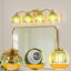 Lámpara baño 4 luces pantalla vidrio verde oro cepillado