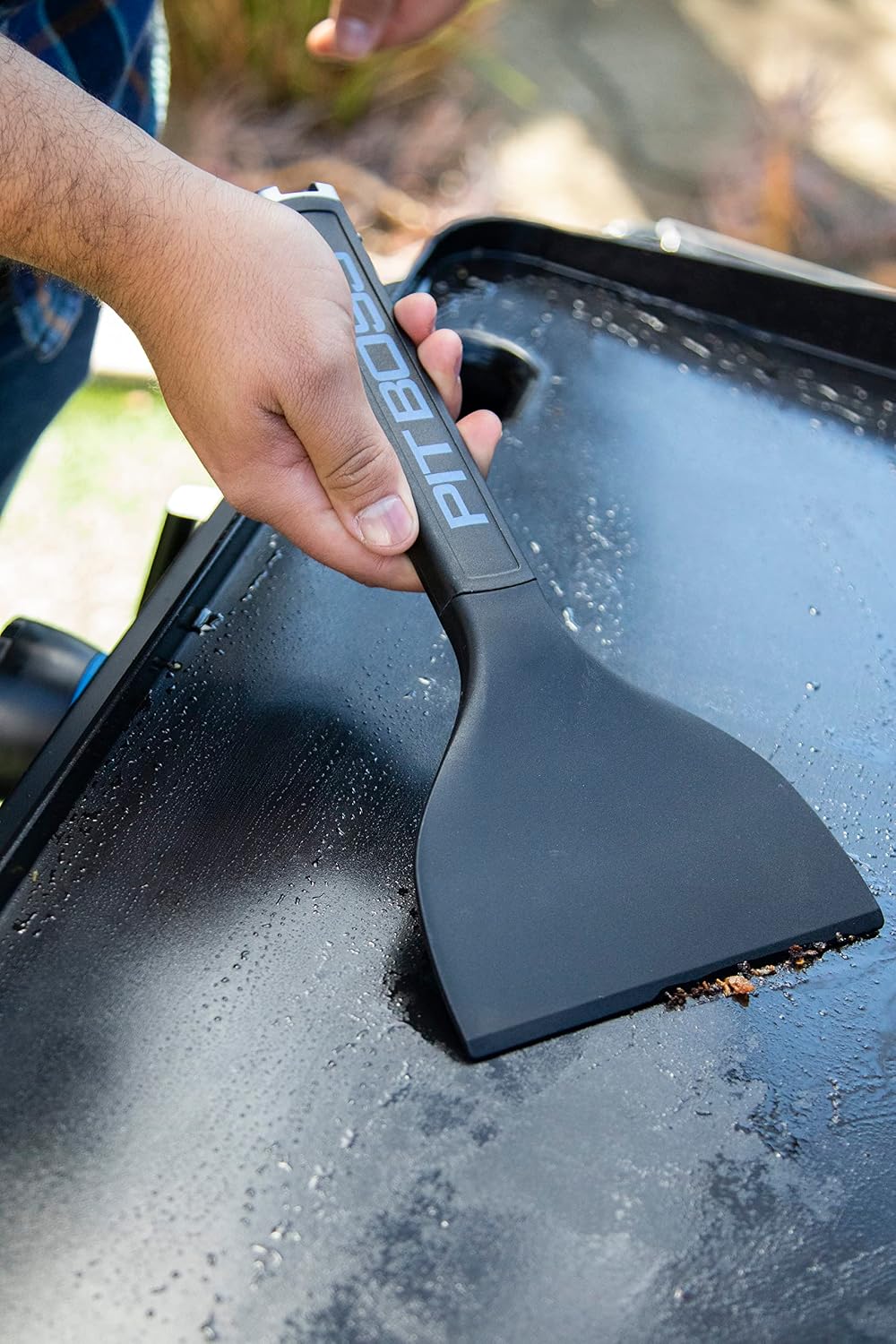 Raspador para plancha color negro